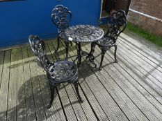 Cast Iron Table with Three Chairs