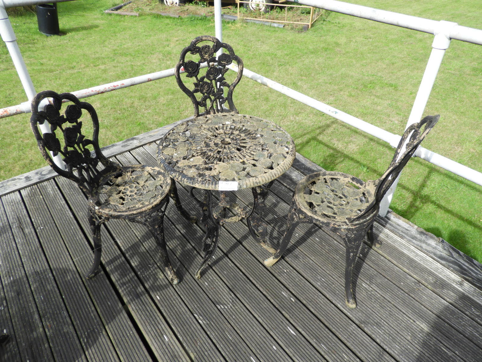 Cast Iron Table with Three Chairs