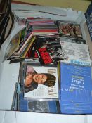 Box of CDs and DVDs