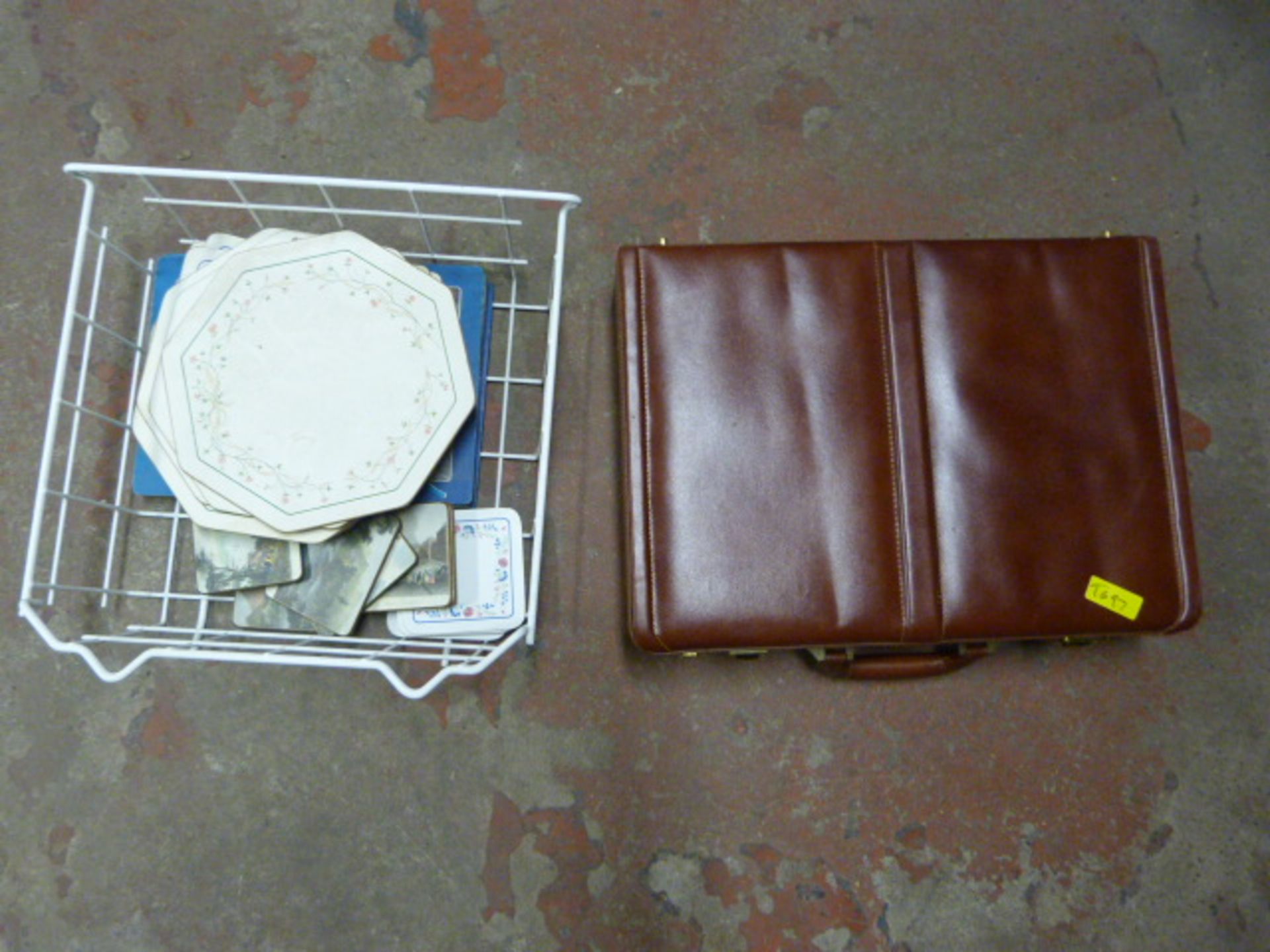 Briefcase and a Basket of Place Mats