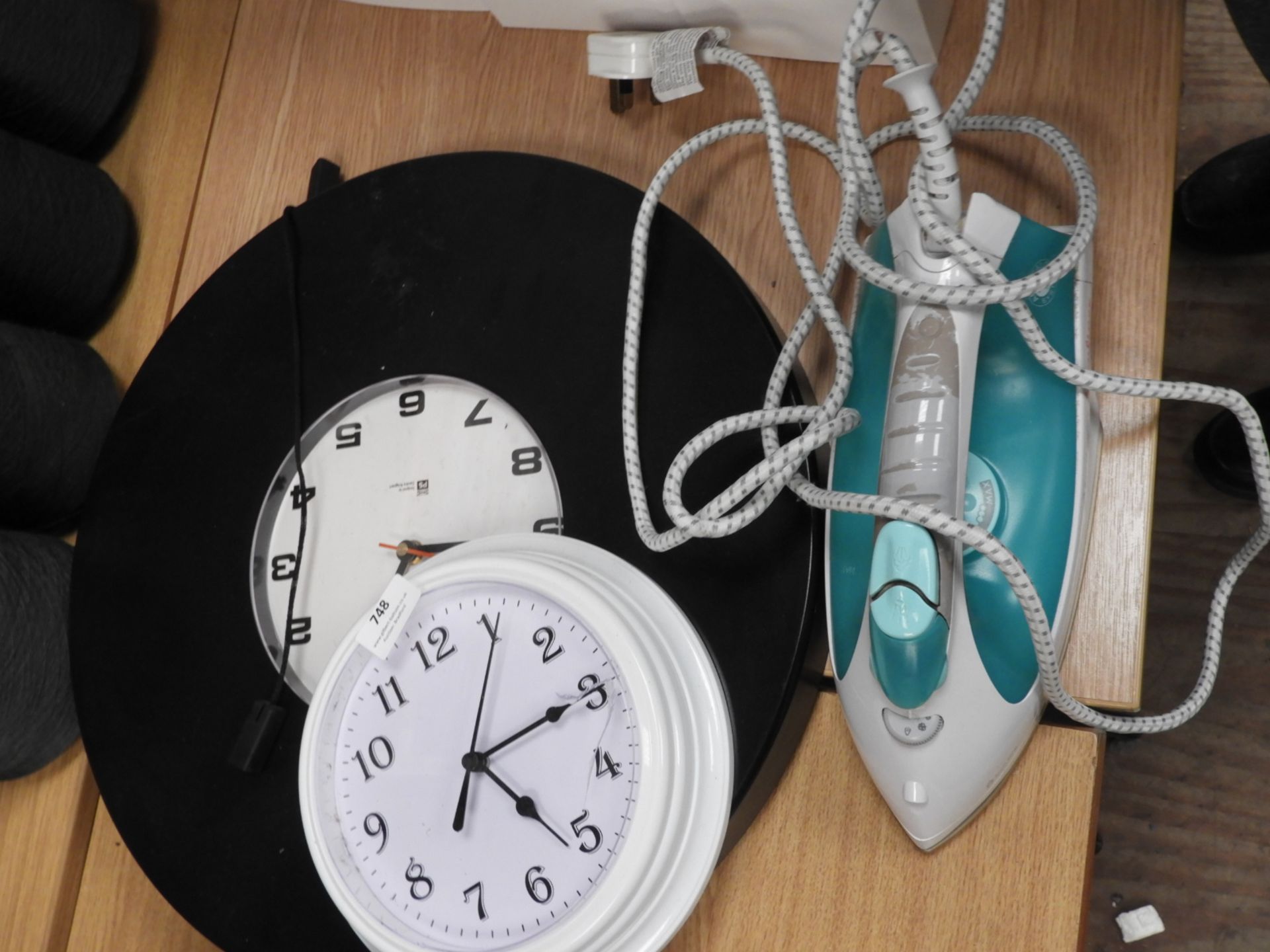 *Two Wall Clocks and a Steam Iron
