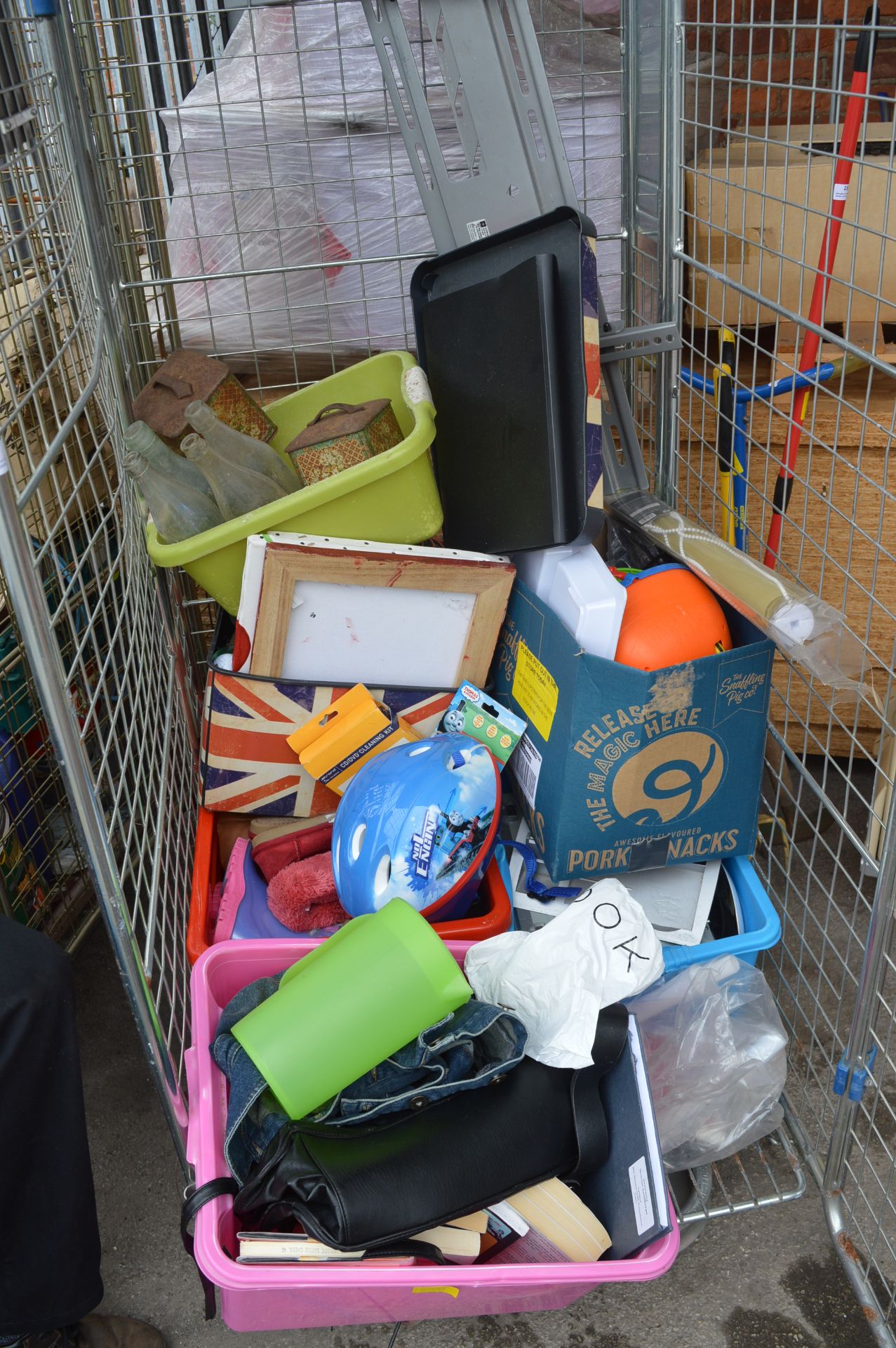 Cage of Assorted Goods; Bicycle Helmets, Books, Pi