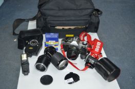 Canon AE1 Camera plus Lenses, Light Meter, Kit Bag