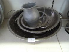 Three Stainless Steel Colanders and a Jug