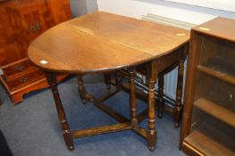 1930's Oak Drop Leaf Oval Dining Table