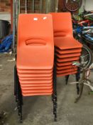 Seventeen Orange Plastic Stacking Chairs