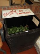 *Storage Box Containing Artificial Foliage and a No Smoking Sign