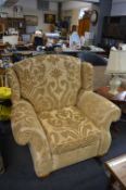 Large Wingback Armchair in Pale Gold with Foliate