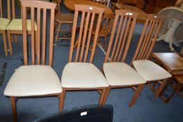 Four Highback Dining Chairs with Cream Leatherette Upholstery