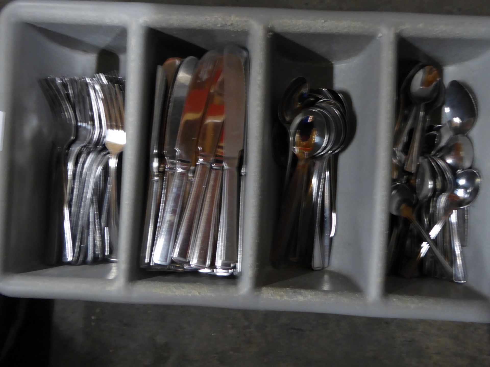 *grey cutlery tray with cutlery assortment