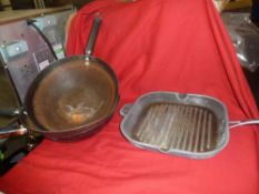 *selection of woks and griddle pan