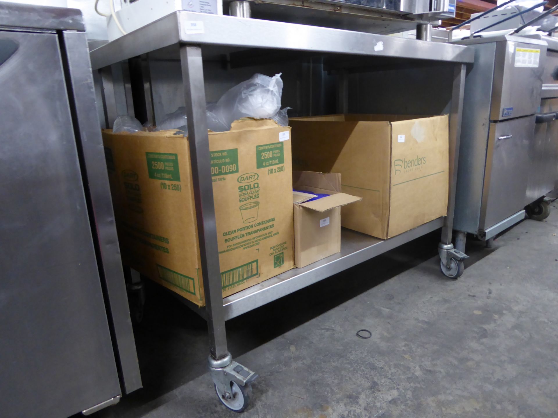 *S/S prep bench on castors with up stand and under shelf 1100w x 700x 890h