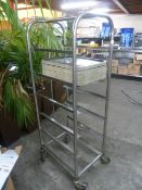 *S/S tray trolley with approx. 30 black trays
