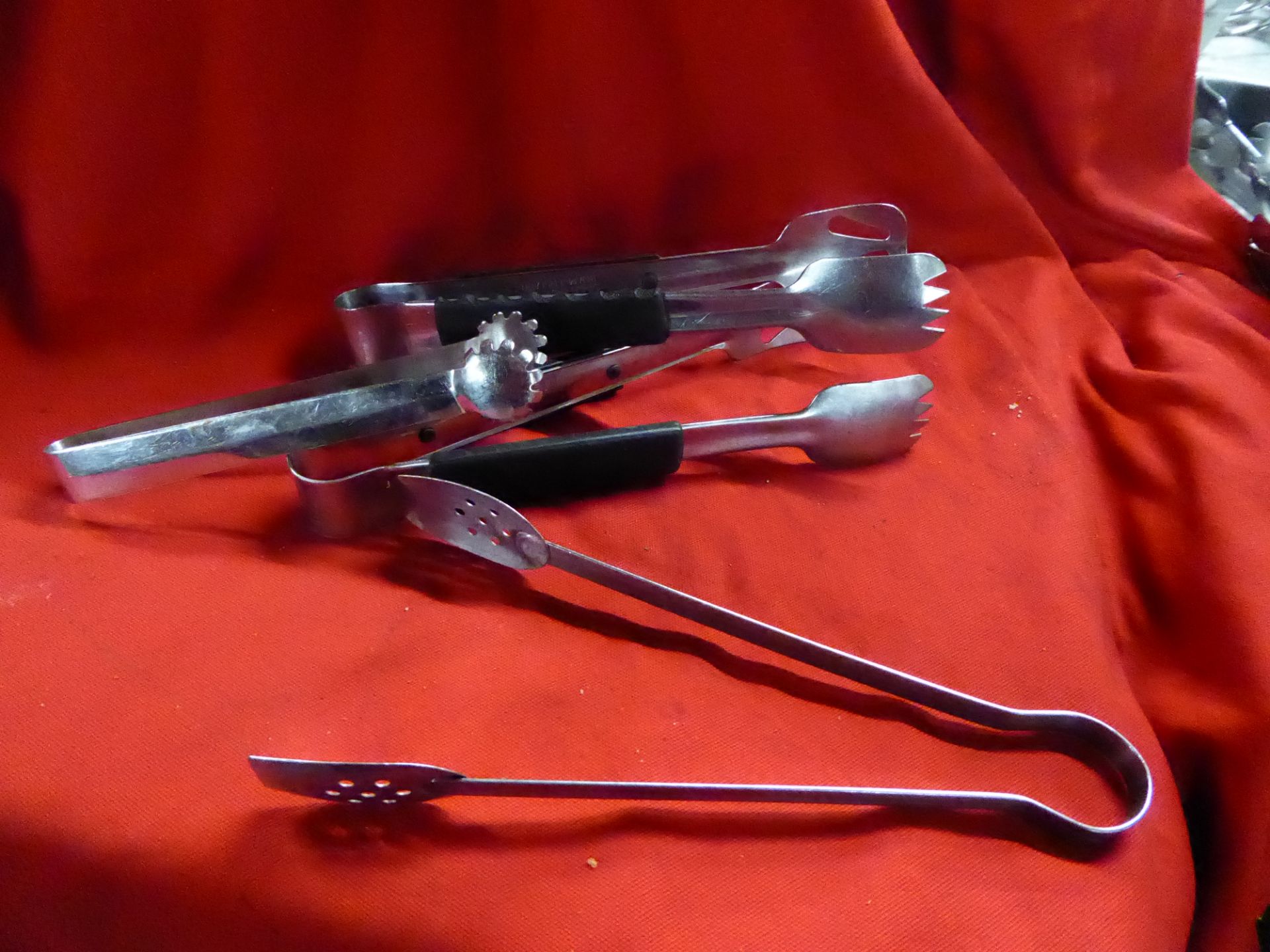 *various sized tongs approx. 10 items