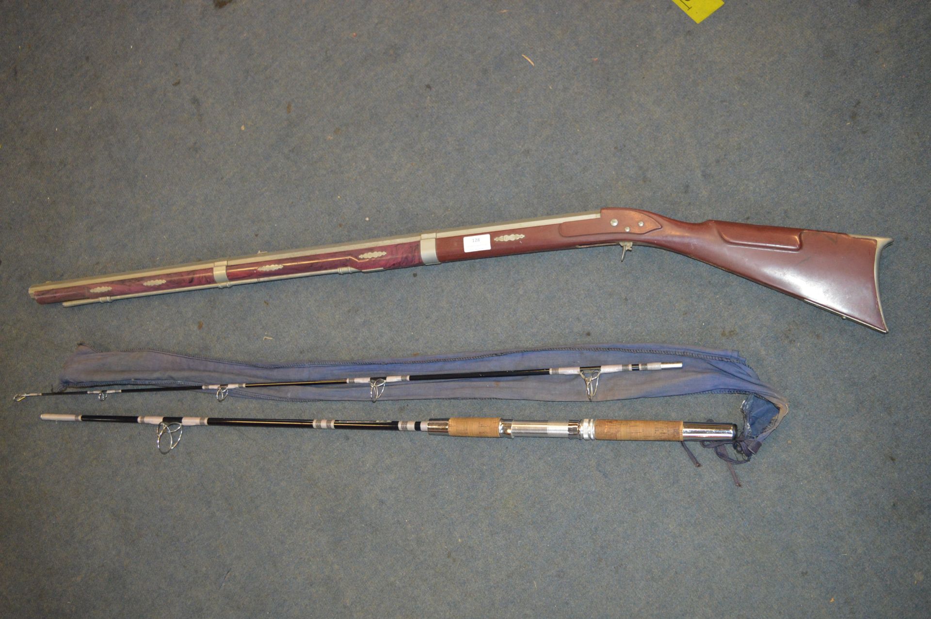 Plastic Replica Flintlock Rifle and a Ryobi Two Piece Fishing Rod