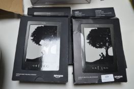 Four Amazon Kindle E-Readers (No Charging Cables)