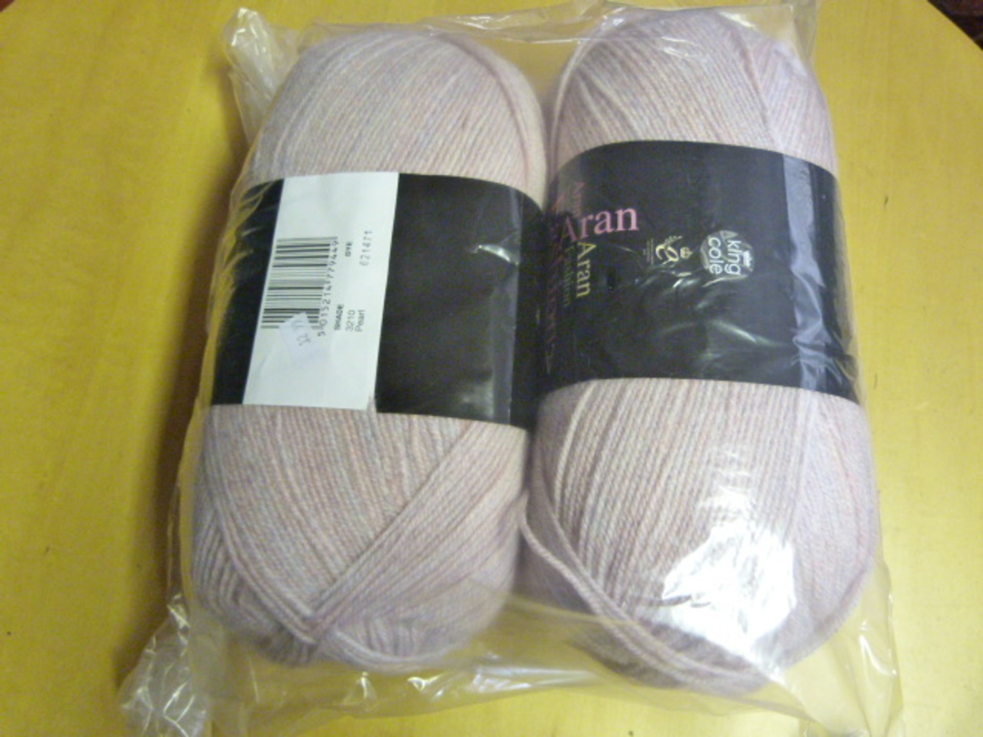 Two Large Rolls of Pearl Pink Wool