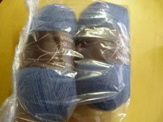 Two Large Rolls of Pale Blue Wool