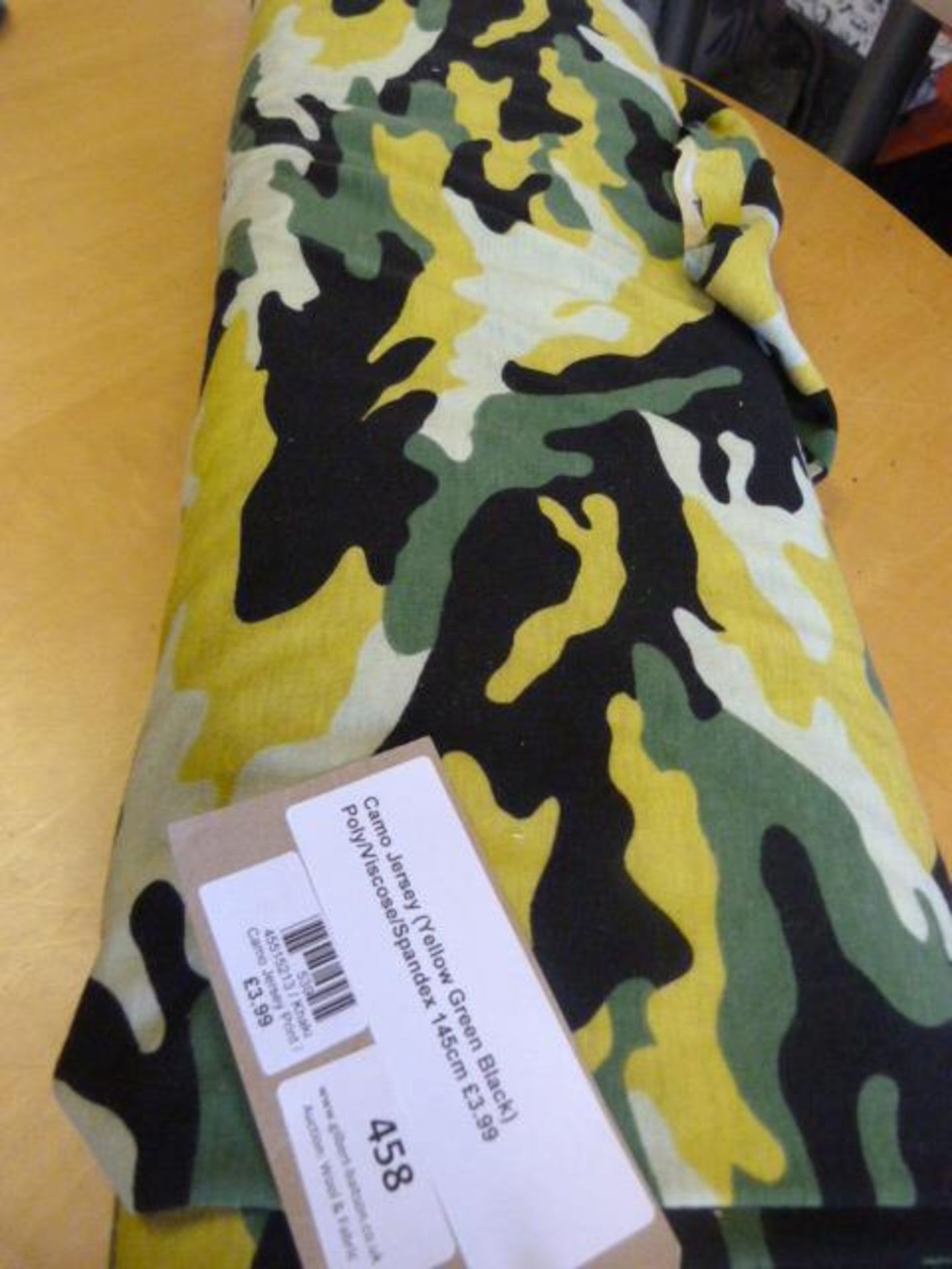 Roll of Yellow, Green & Black Camo Jersey Poly Viscose Spandex Fabric