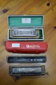 Three Hohner Harmonicas