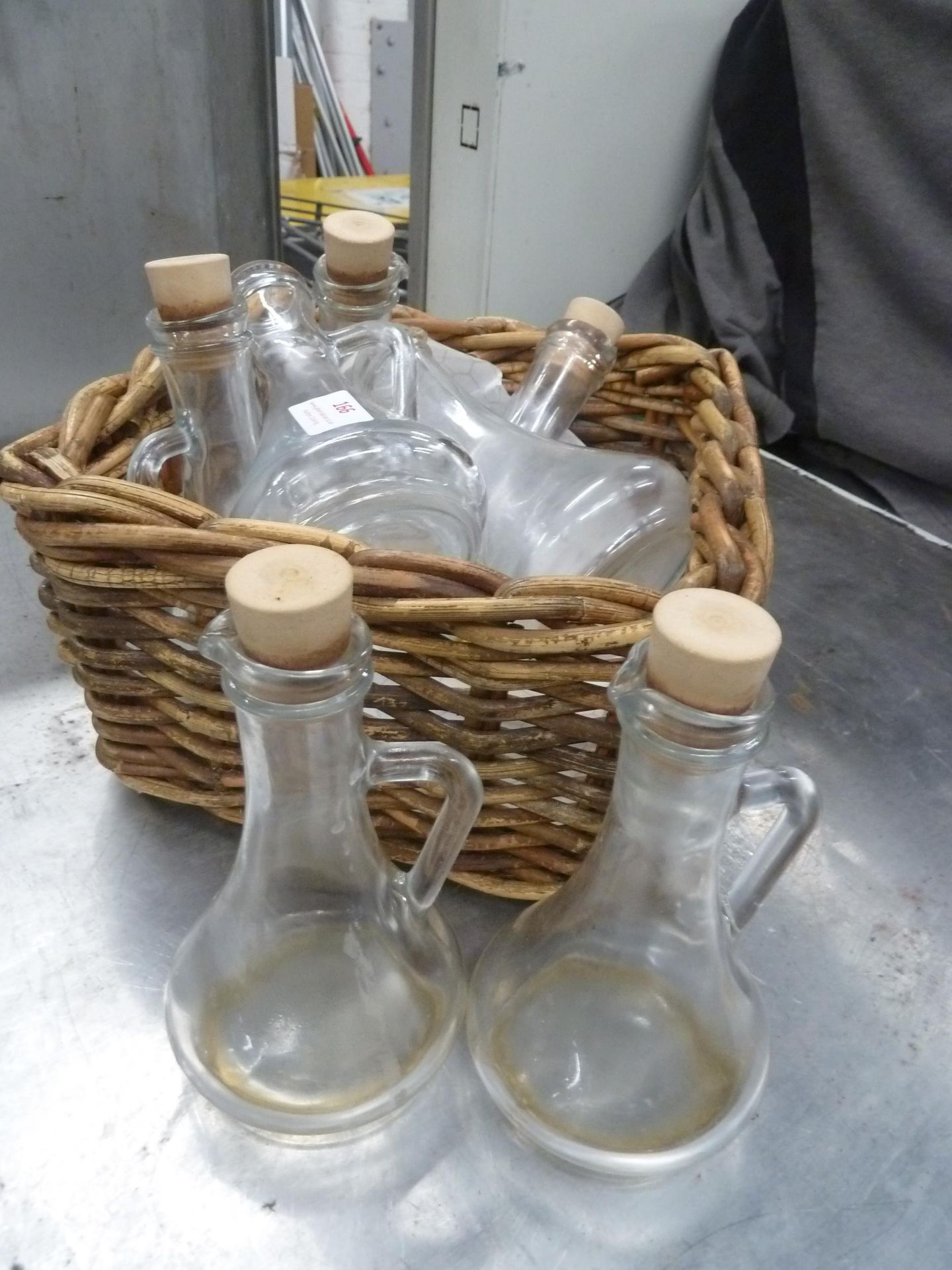 * basket with 7 x vinegar bottles