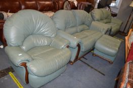 Green Leather Four Piece Suite; Two Two Seat Sofas