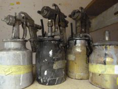 Three Spray Guns and a Spare Canister