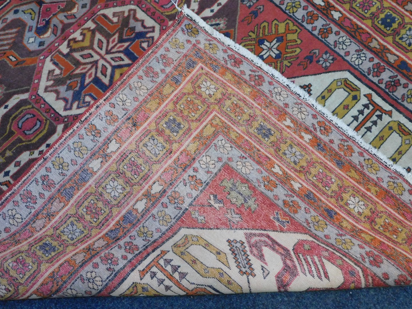 An Azerbaijan Kazak rug, with three central medallions on a red ground, enclosed by triple borders - Image 4 of 4