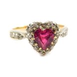 A Victorian ruby and diamond heart shaped ring, the heart shaped ruby in a surround of old cut