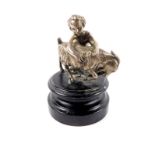 A late 19thC Continental silver plated figure group, cast as a Putto and Ram, raised on an