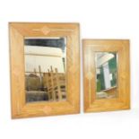 A pair of graduated mango wood and marble inlaid rectangular wall mirrors, inset bevelled glass,