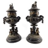 A pair of late 19thC Continental spelter urns and covers, of twin handled semi fluted form, cast