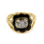 A George IV 18ct gold diamond and enamel mourning ring, set with an oval cut diamond, on an open