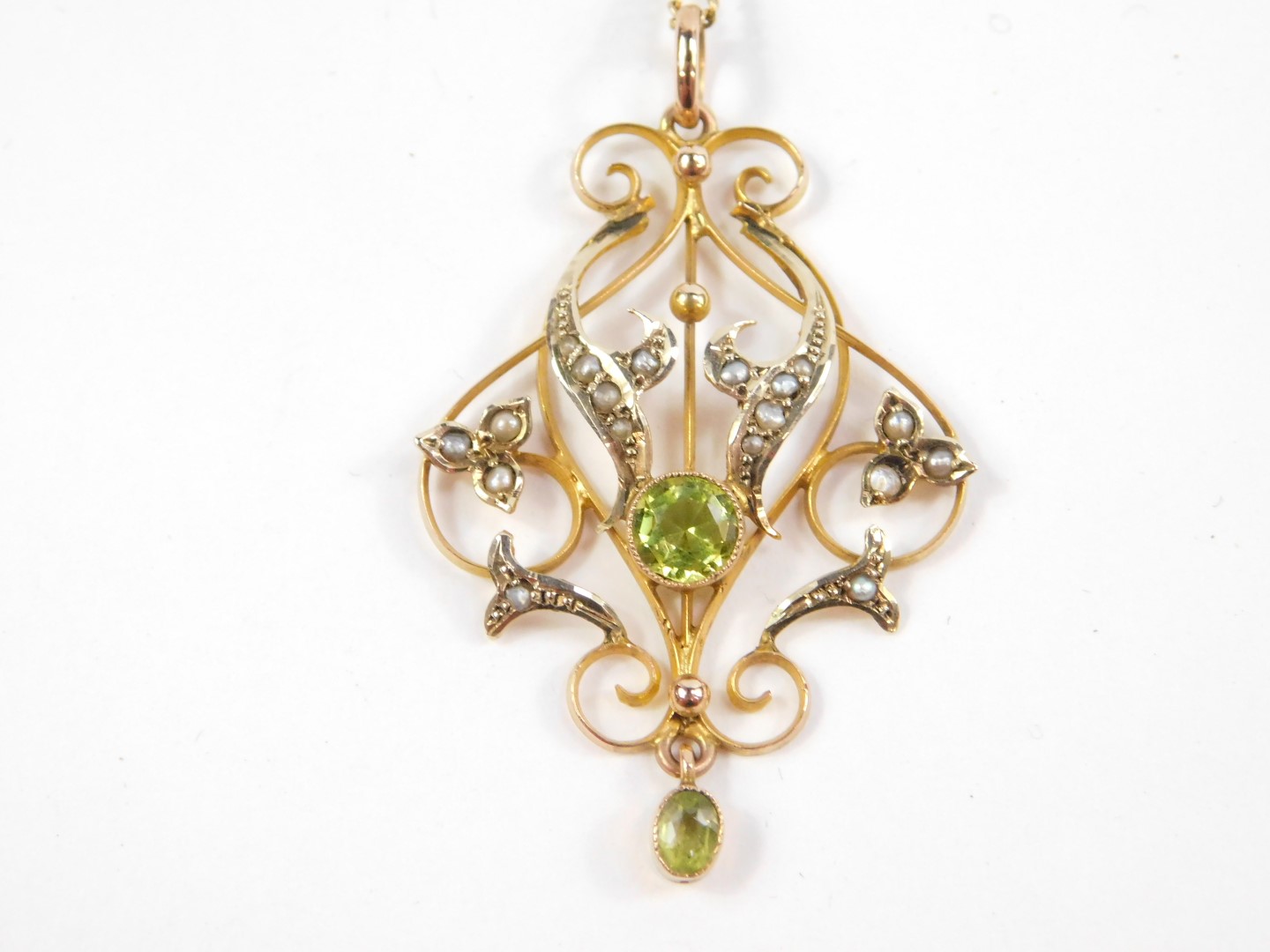 An Edwardian peridot and seed pearl pendant, of scrolling foliate design, set in yellow metal - Image 2 of 3