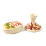 A Moorcroft pottery oval box and cover, decorated in the Pink Geranium pattern, impressed marks,