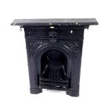 A Victorian black painted cast iron fire surround, with embossed floral decoration, 91.5cm H, 64cm