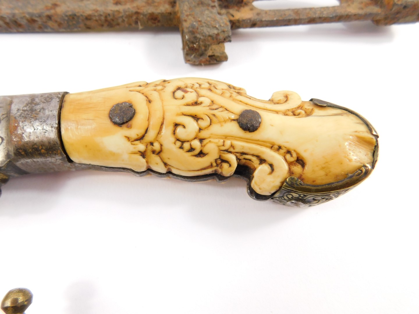 A 19thC hunting knife, possibly Indonesian with an engraved steel blade, and carved ivory and - Image 3 of 6