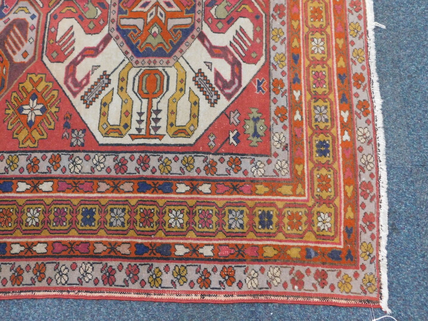 An Azerbaijan Kazak rug, with three central medallions on a red ground, enclosed by triple borders - Image 3 of 4