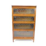 An early 20thC Globe Wernicke mahogany four section bookcase, with astragal glazed up and over