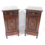 A pair of Adams style Edwardian mahogany side dining pedestals, each with a drawer carved with