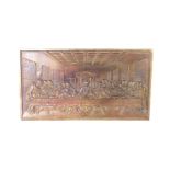 After Leonard De Vinci. A brass plaque cast in relief of The Last Supper, 35cm H, 63.5cm W.