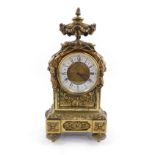 A late 19thC Continental brass mantel clock case, with later dial and Quartz movement, the case cast