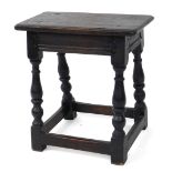 A 17thC style oak joint stool, raised on baluster turned supports united by stretchers.
