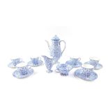 A Royal Doulton early 20thC blue and white porcelain coffee service, decorated with a floral sheet