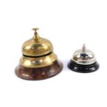 A mid 20thC brass and walnut reception bell, 12cm dia, together with a later bell, 8cm dia (2)