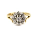 A diamond set flower head ring, set with rose cut diamonds in yellow metal, stamped 18ct, approx 3/