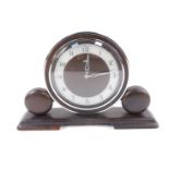 A Metamec Art Deco oak and chrome mantel clock, circular dial with silvered chapter ring bearing