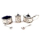 A Georgian style silver 3 piece condiment set, of serpentine form with pierced and engraved