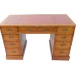 A Victorian oak twin pedestal desk, the top with chevron inlay and a gilt tooled red leather writing