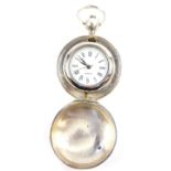 A lady's silver hunter pocket watch, removable watch with white dial bearing Roman numerals,